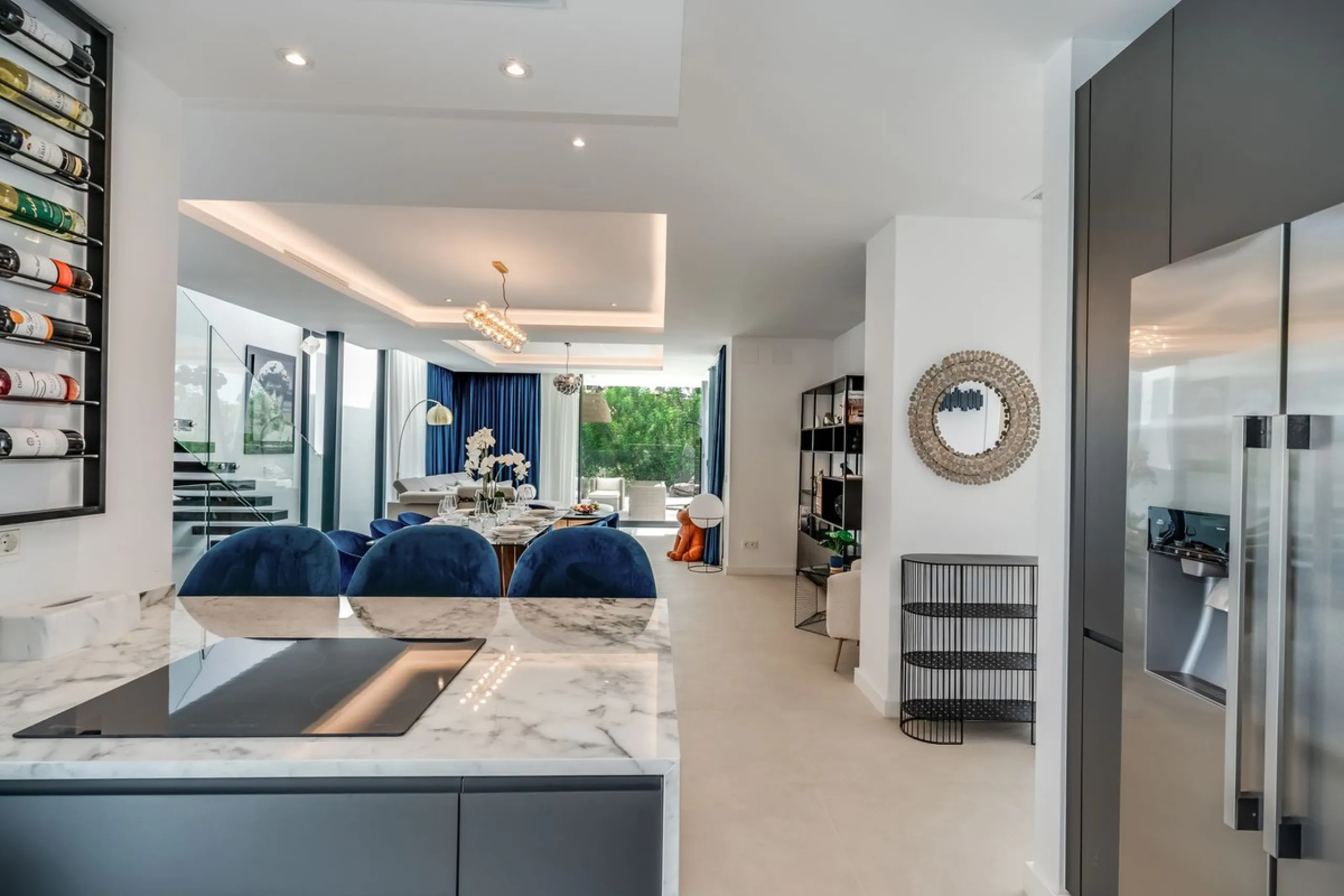 Nestled along the lush greens of Marbella's finest golf course of El Campanario, this luxurious 5-bedroom, 4.5-bath villa offers a seamless blend of elegance and state-of-the-art comfort over 460 square meters of living space. The villa's open layout invi
