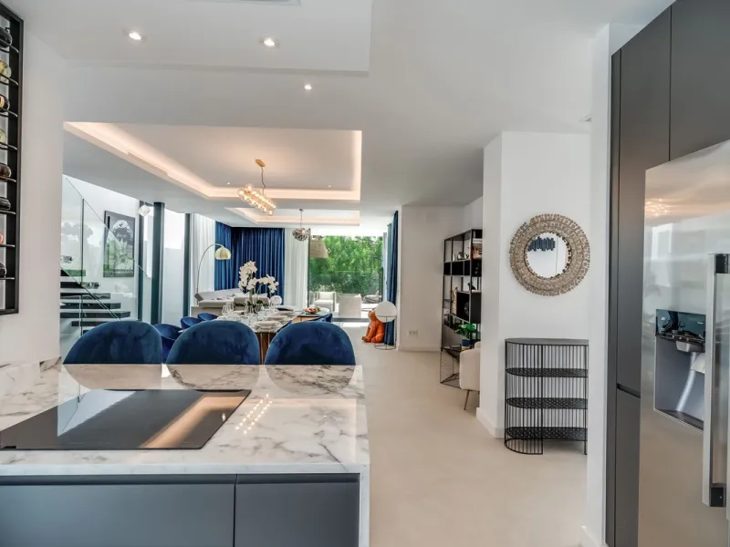 Nestled along the lush greens of Marbella's finest golf course of El Campanario, this luxurious 5-bedroom, 4.5-bath villa offers a seamless blend of elegance and state-of-the-art comfort over 460 square meters of living space. The villa's open layout invi
