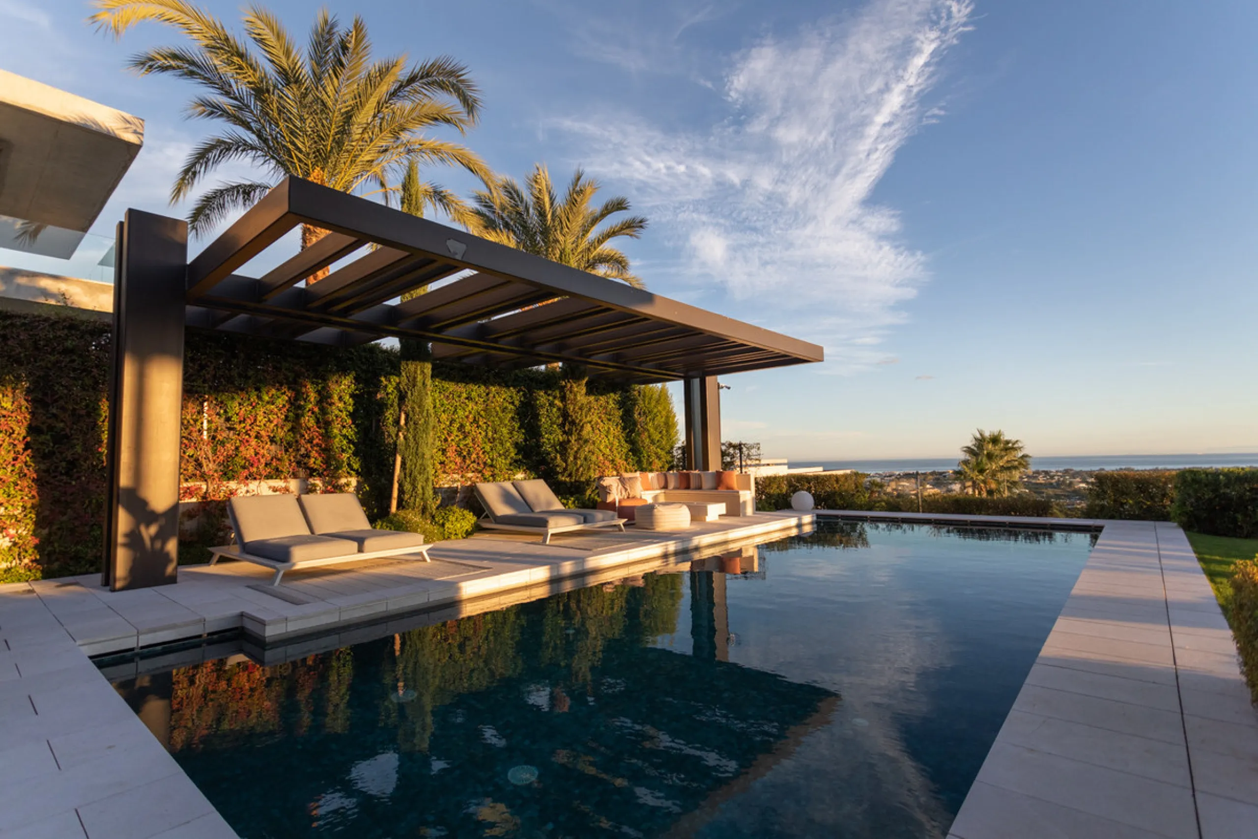 Welcome to a stunning property in The Hills, an exclusive neighborhood perched on La Quinta's cliffside. Overlooking the Mediterranean Sea, Puerto Banús, and San Pedro, this villa boasts incredible 200-degree views reaching all the way to Gibraltar and No
