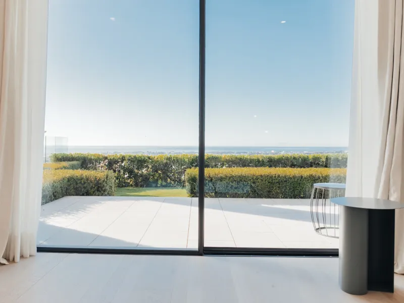 Welcome to a stunning property in The Hills, an exclusive neighborhood perched on La Quinta's cliffside. Overlooking the Mediterranean Sea, Puerto Banús, and San Pedro, this villa boasts incredible 200-degree views reaching all the way to Gibraltar and No