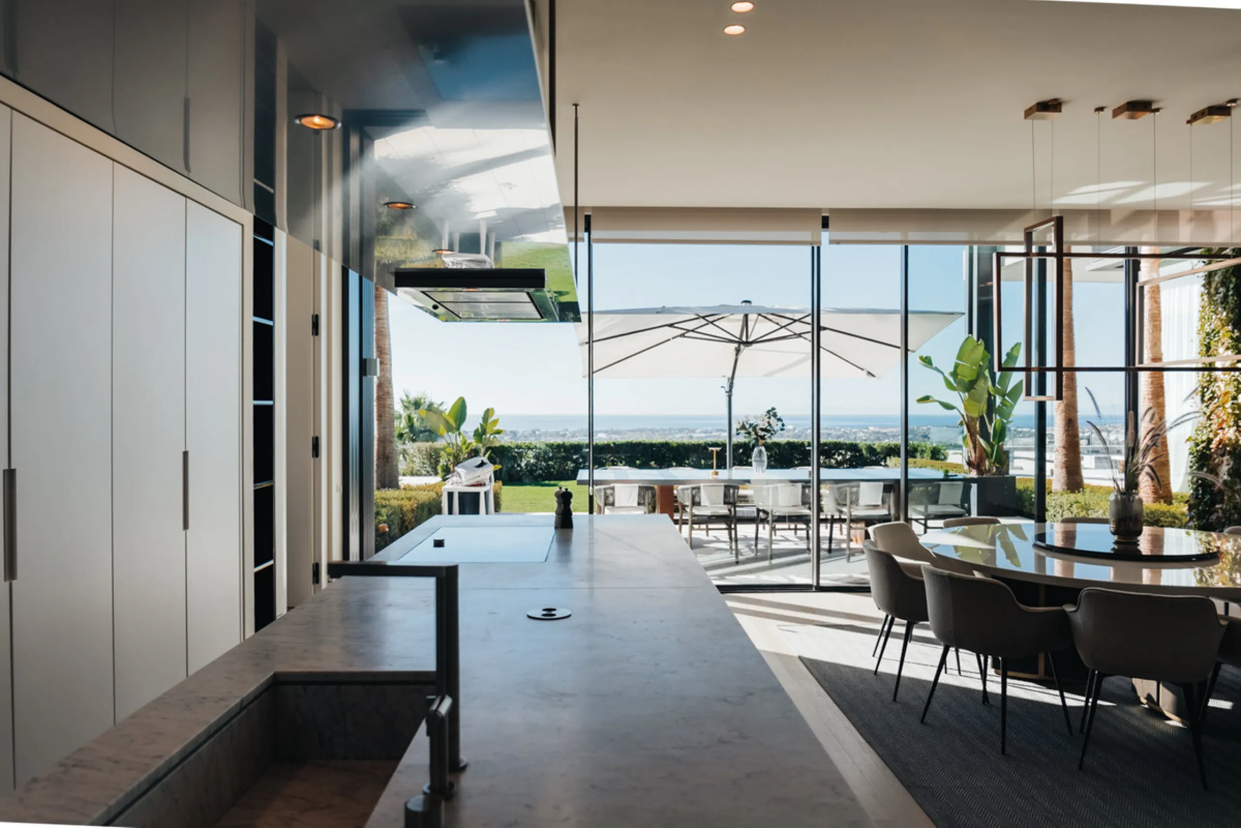 Welcome to a stunning property in The Hills, an exclusive neighborhood perched on La Quinta's cliffside. Overlooking the Mediterranean Sea, Puerto Banús, and San Pedro, this villa boasts incredible 200-degree views reaching all the way to Gibraltar and No