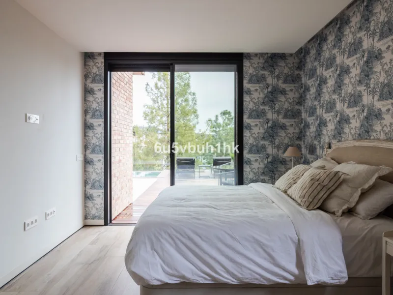 Exquisite modern villa, a newly built family home that perfectly blends contemporary design with comfort and convenience. Nestled in the desirable neighborhood of El Atabal, Malaga, this three-story residence offers breathtaking sea and mountain views fro