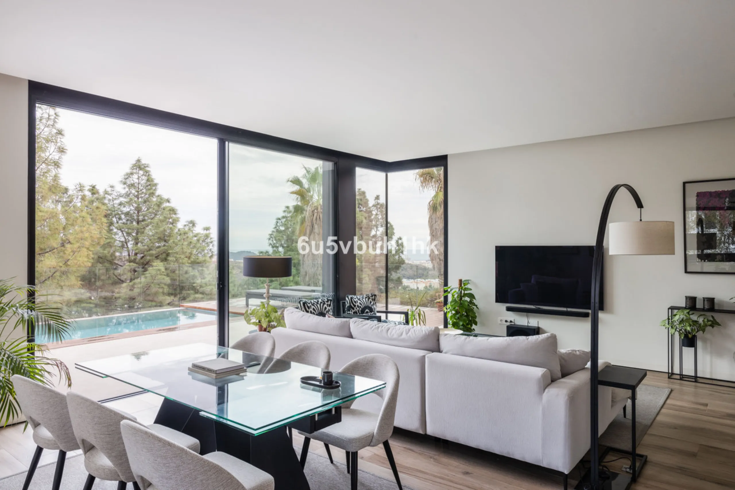 Exquisite modern villa, a newly built family home that perfectly blends contemporary design with comfort and convenience. Nestled in the desirable neighborhood of El Atabal, Malaga, this three-story residence offers breathtaking sea and mountain views fro