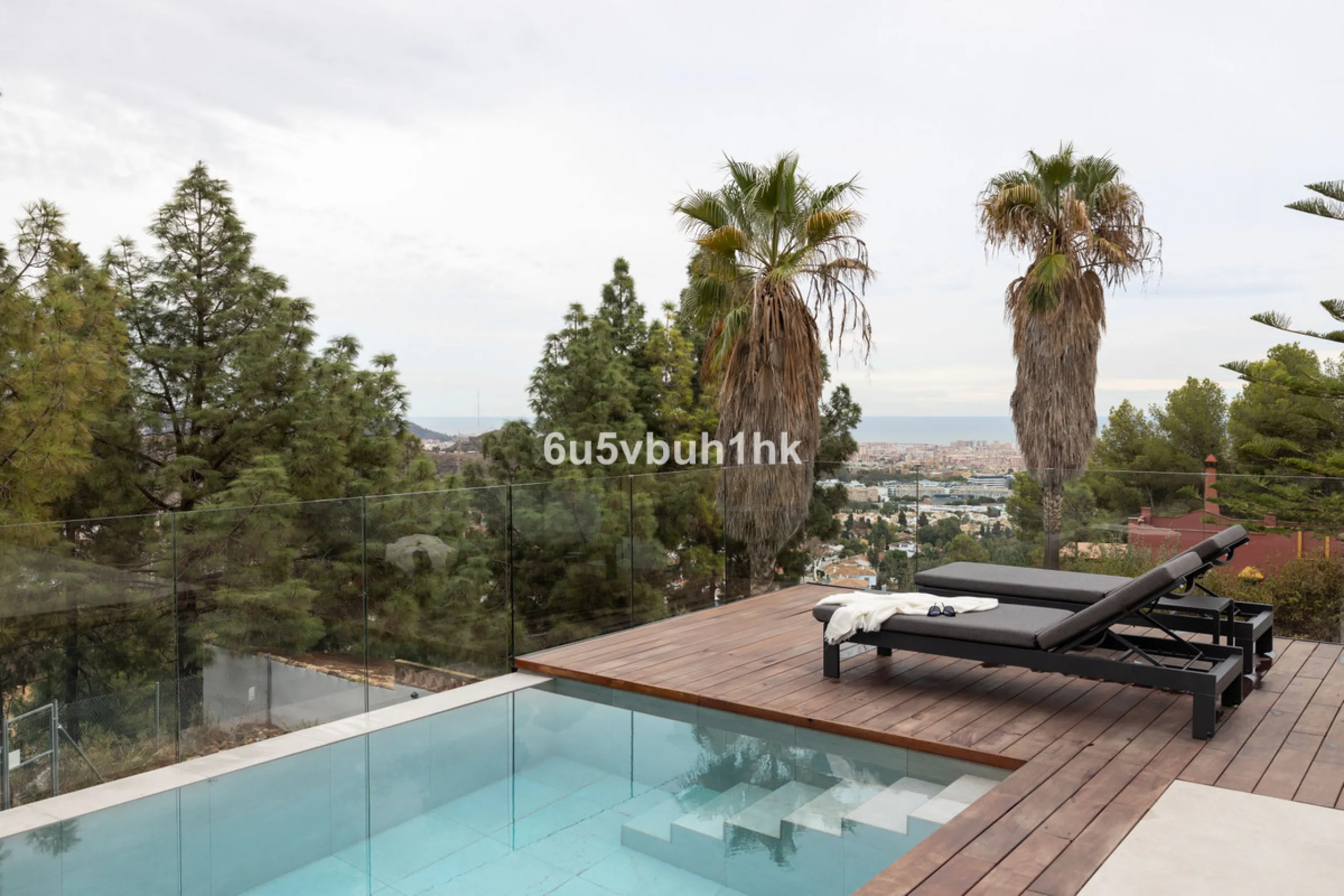 Exquisite modern villa, a newly built family home that perfectly blends contemporary design with comfort and convenience. Nestled in the desirable neighborhood of El Atabal, Malaga, this three-story residence offers breathtaking sea and mountain views fro