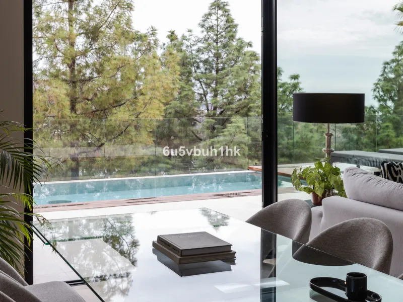 Exquisite modern villa, a newly built family home that perfectly blends contemporary design with comfort and convenience. Nestled in the desirable neighborhood of El Atabal, Malaga, this three-story residence offers breathtaking sea and mountain views fro