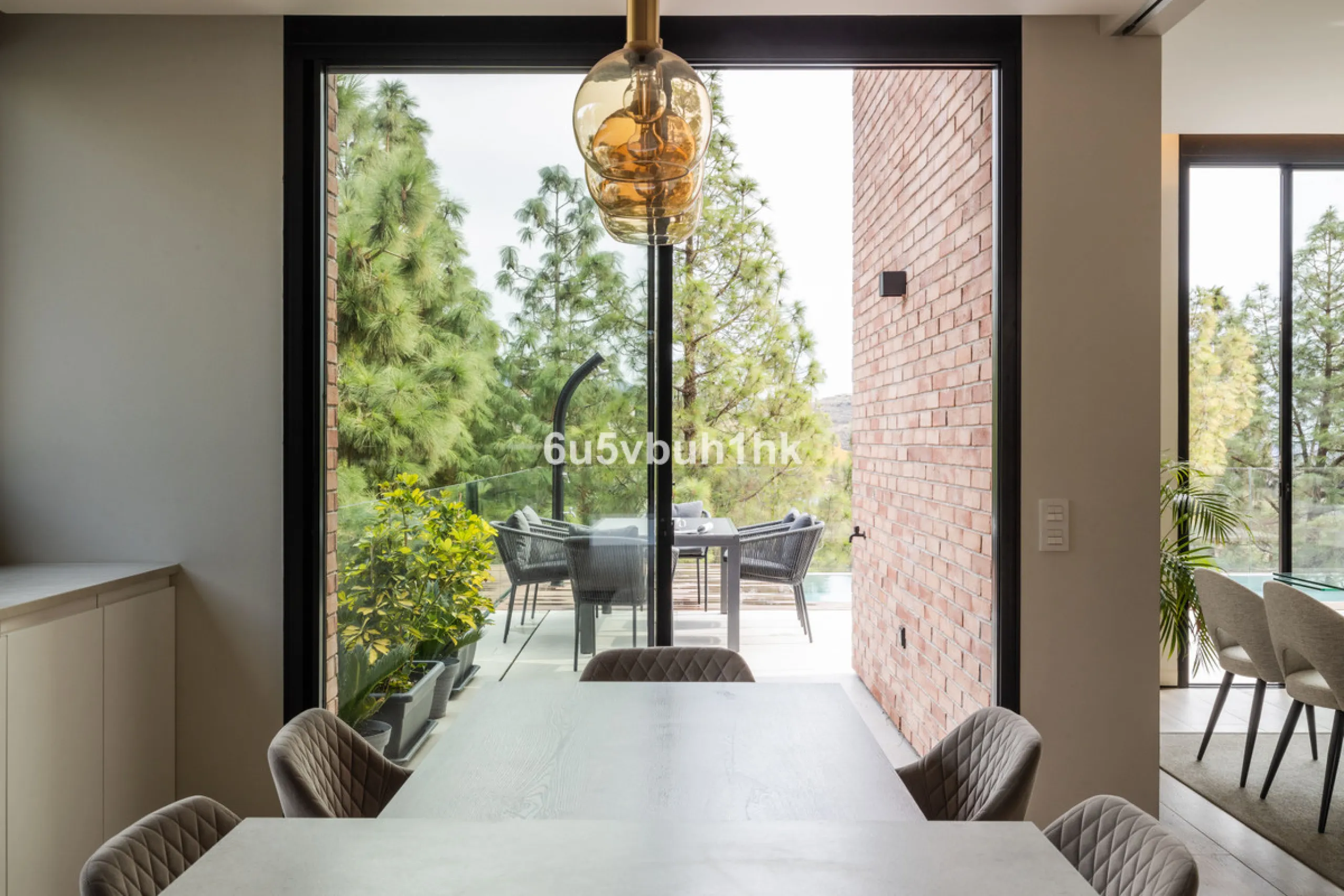 Exquisite modern villa, a newly built family home that perfectly blends contemporary design with comfort and convenience. Nestled in the desirable neighborhood of El Atabal, Malaga, this three-story residence offers breathtaking sea and mountain views fro