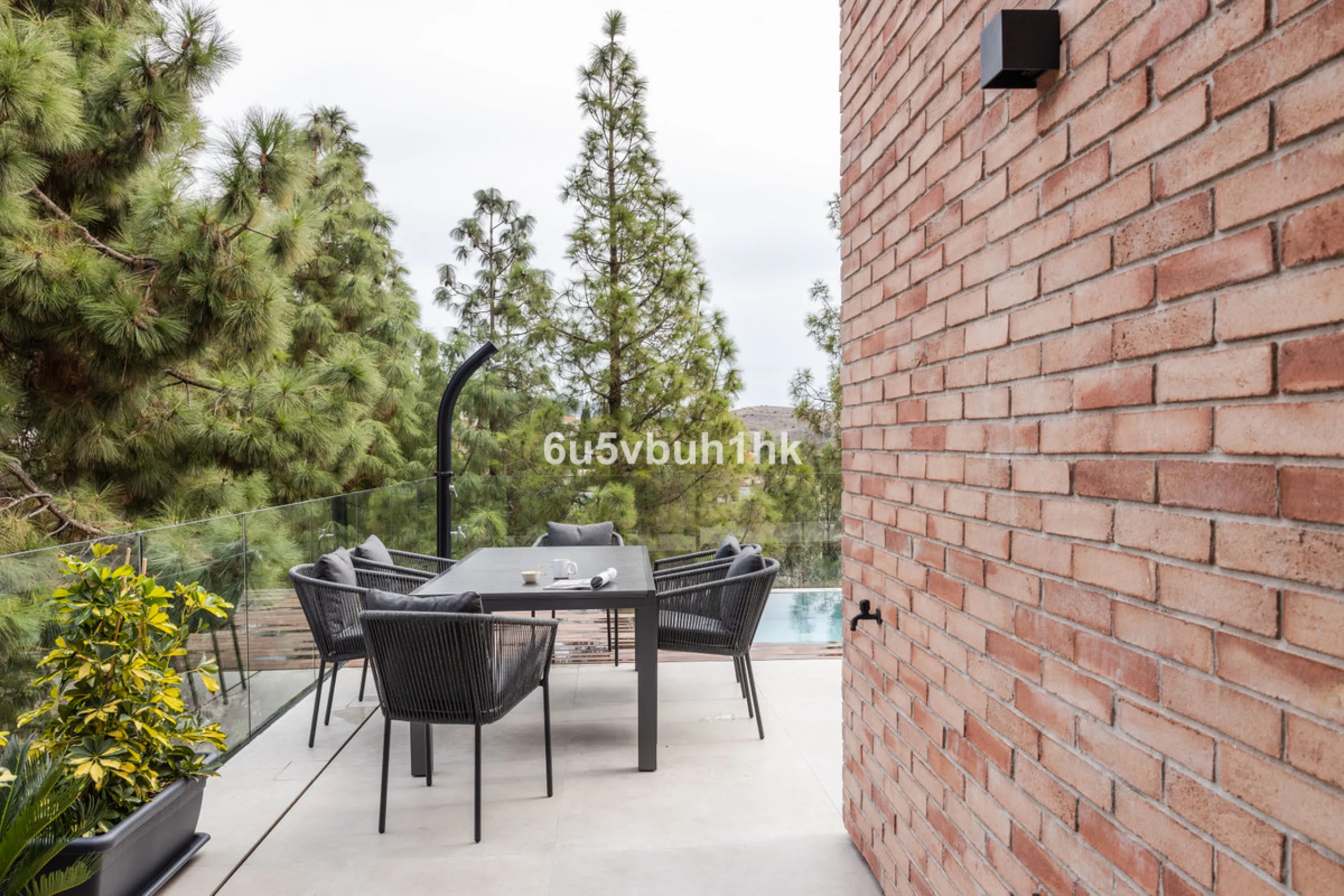Exquisite modern villa, a newly built family home that perfectly blends contemporary design with comfort and convenience. Nestled in the desirable neighborhood of El Atabal, Malaga, this three-story residence offers breathtaking sea and mountain views fro