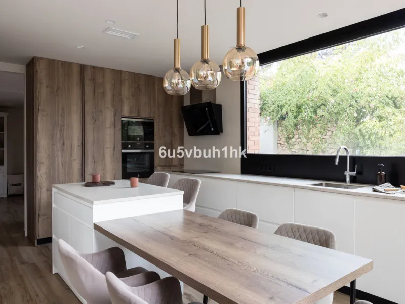 Exquisite modern villa, a newly built family home that perfectly blends contemporary design with comfort and convenience. Nestled in the desirable neighborhood of El Atabal, Malaga, this three-story residence offers breathtaking sea and mountain views fro
