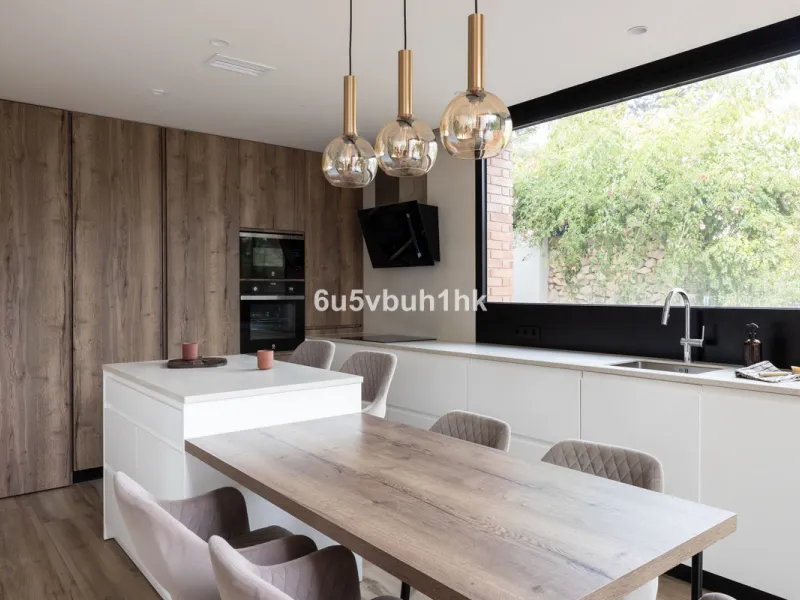 Exquisite modern villa, a newly built family home that perfectly blends contemporary design with comfort and convenience. Nestled in the desirable neighborhood of El Atabal, Malaga, this three-story residence offers breathtaking sea and mountain views fro