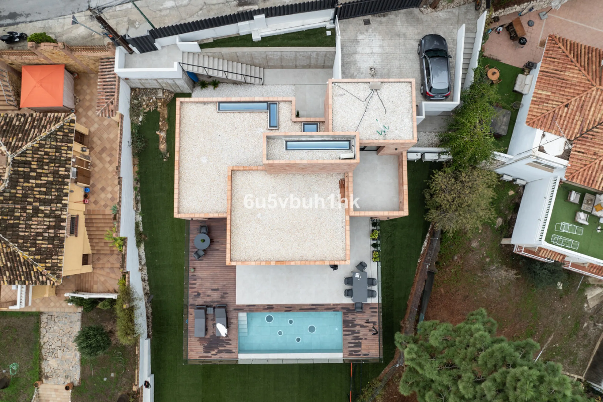 Exquisite modern villa, a newly built family home that perfectly blends contemporary design with comfort and convenience. Nestled in the desirable neighborhood of El Atabal, Malaga, this three-story residence offers breathtaking sea and mountain views fro