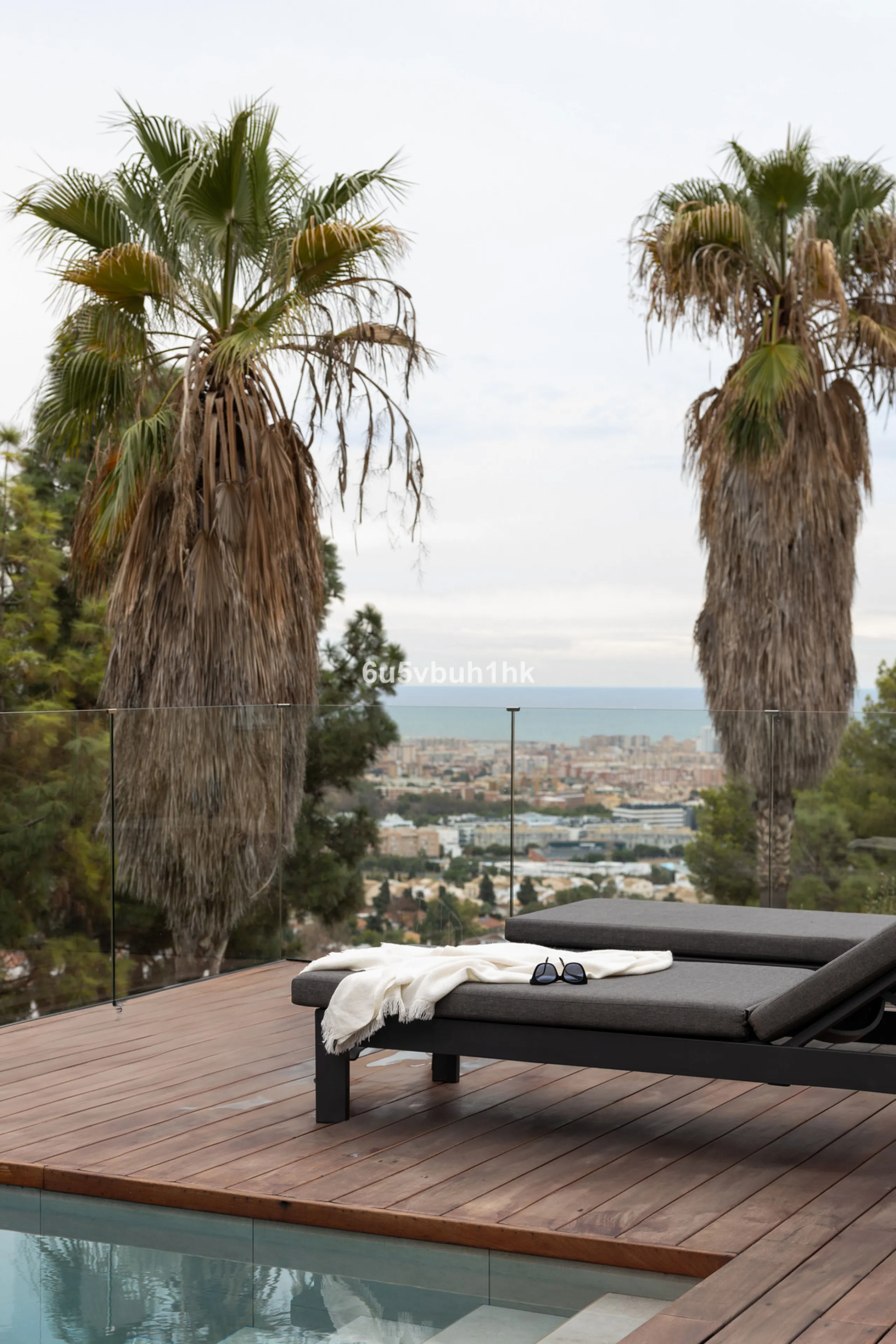 Exquisite modern villa, a newly built family home that perfectly blends contemporary design with comfort and convenience. Nestled in the desirable neighborhood of El Atabal, Malaga, this three-story residence offers breathtaking sea and mountain views fro