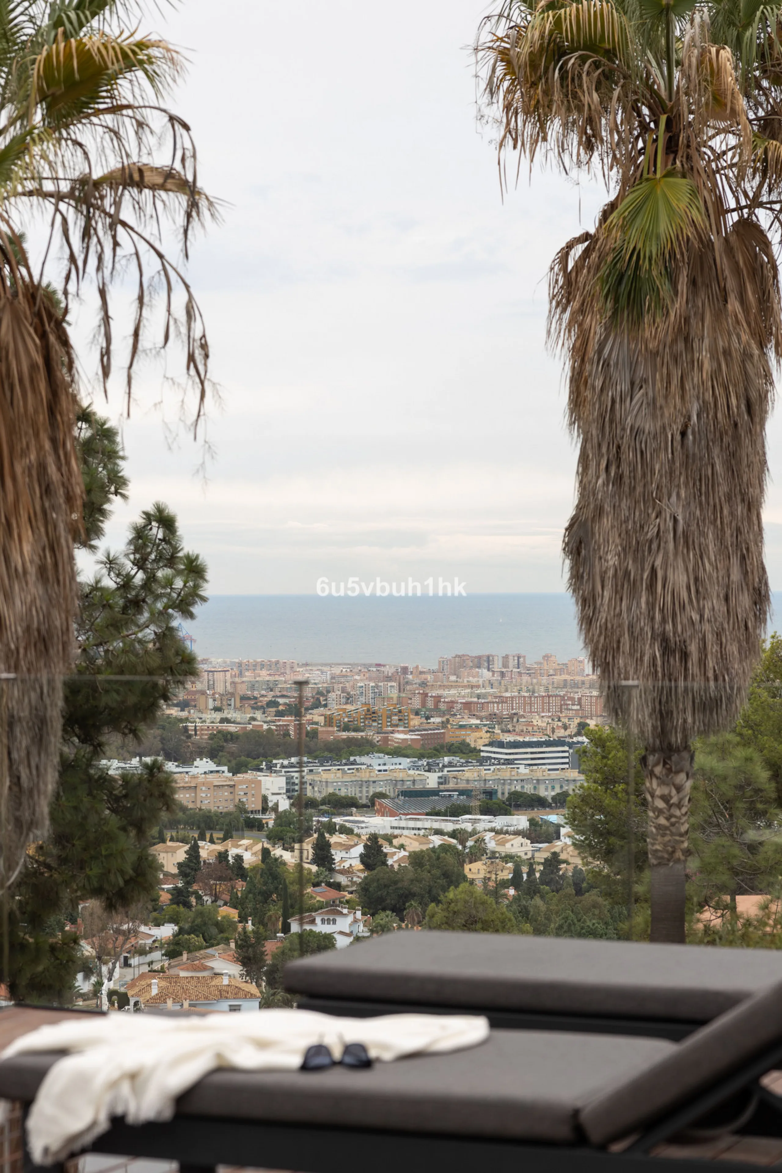 Exquisite modern villa, a newly built family home that perfectly blends contemporary design with comfort and convenience. Nestled in the desirable neighborhood of El Atabal, Malaga, this three-story residence offers breathtaking sea and mountain views fro