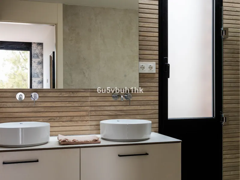 Exquisite modern villa, a newly built family home that perfectly blends contemporary design with comfort and convenience. Nestled in the desirable neighborhood of El Atabal, Malaga, this three-story residence offers breathtaking sea and mountain views fro