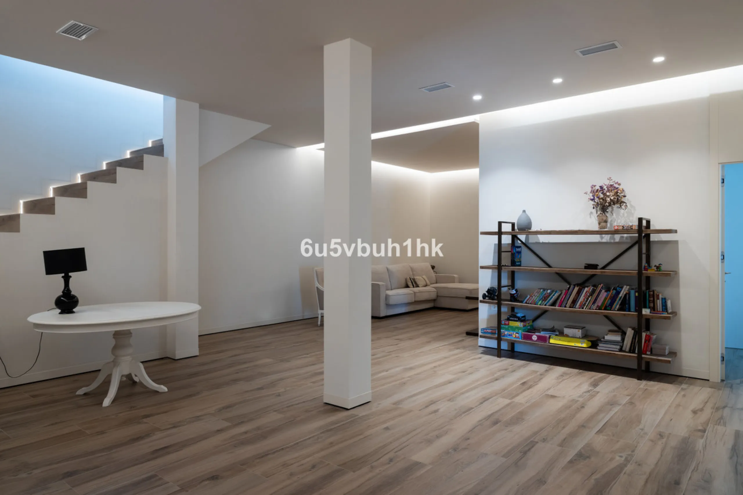 Exquisite modern villa, a newly built family home that perfectly blends contemporary design with comfort and convenience. Nestled in the desirable neighborhood of El Atabal, Malaga, this three-story residence offers breathtaking sea and mountain views fro