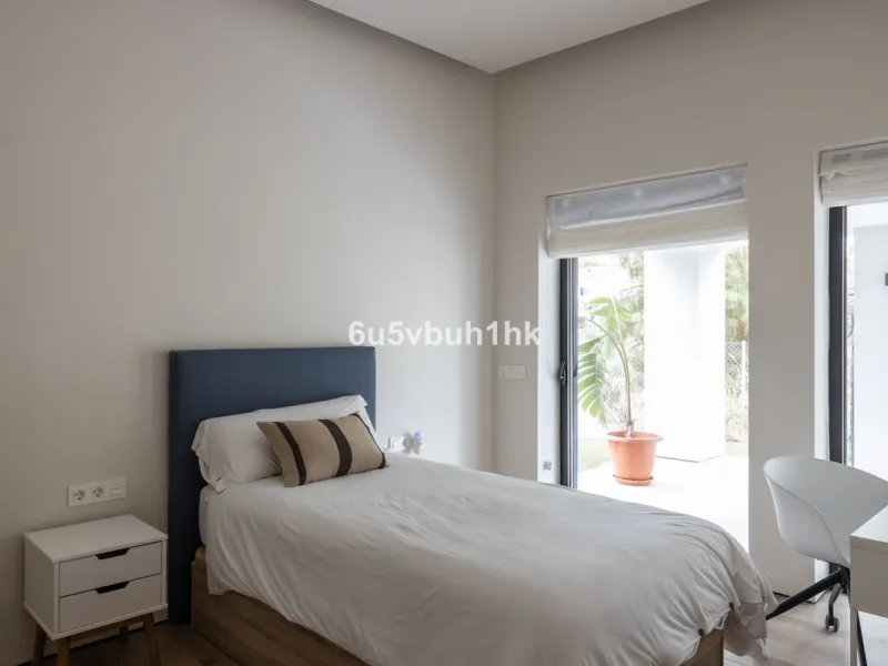 Exquisite modern villa, a newly built family home that perfectly blends contemporary design with comfort and convenience. Nestled in the desirable neighborhood of El Atabal, Malaga, this three-story residence offers breathtaking sea and mountain views fro