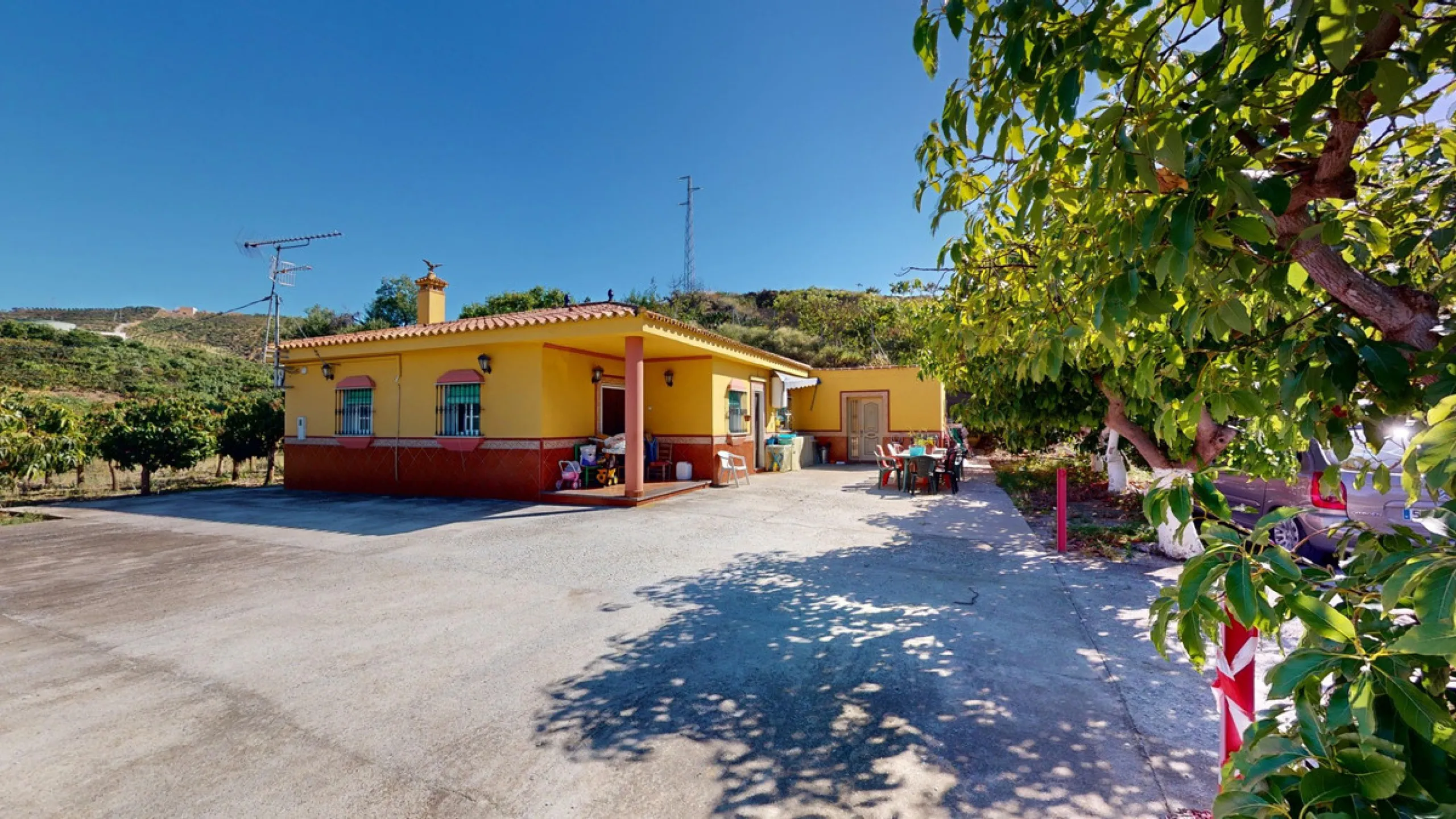 This charming finca is situated in a serene and peaceful location, offering picturesque views of the surrounding landscape. The expansive property boasts 280 magnificent mango trees, 90 stately avocado trees, and several blooming citrus trees, creating a 