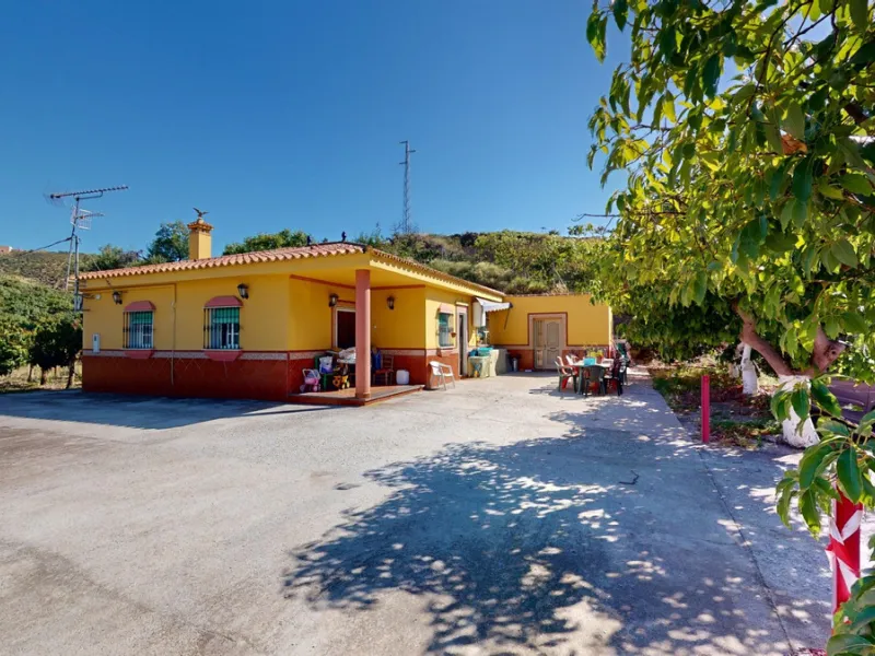 This charming finca is situated in a serene and peaceful location, offering picturesque views of the surrounding landscape. The expansive property boasts 280 magnificent mango trees, 90 stately avocado trees, and several blooming citrus trees, creating a 