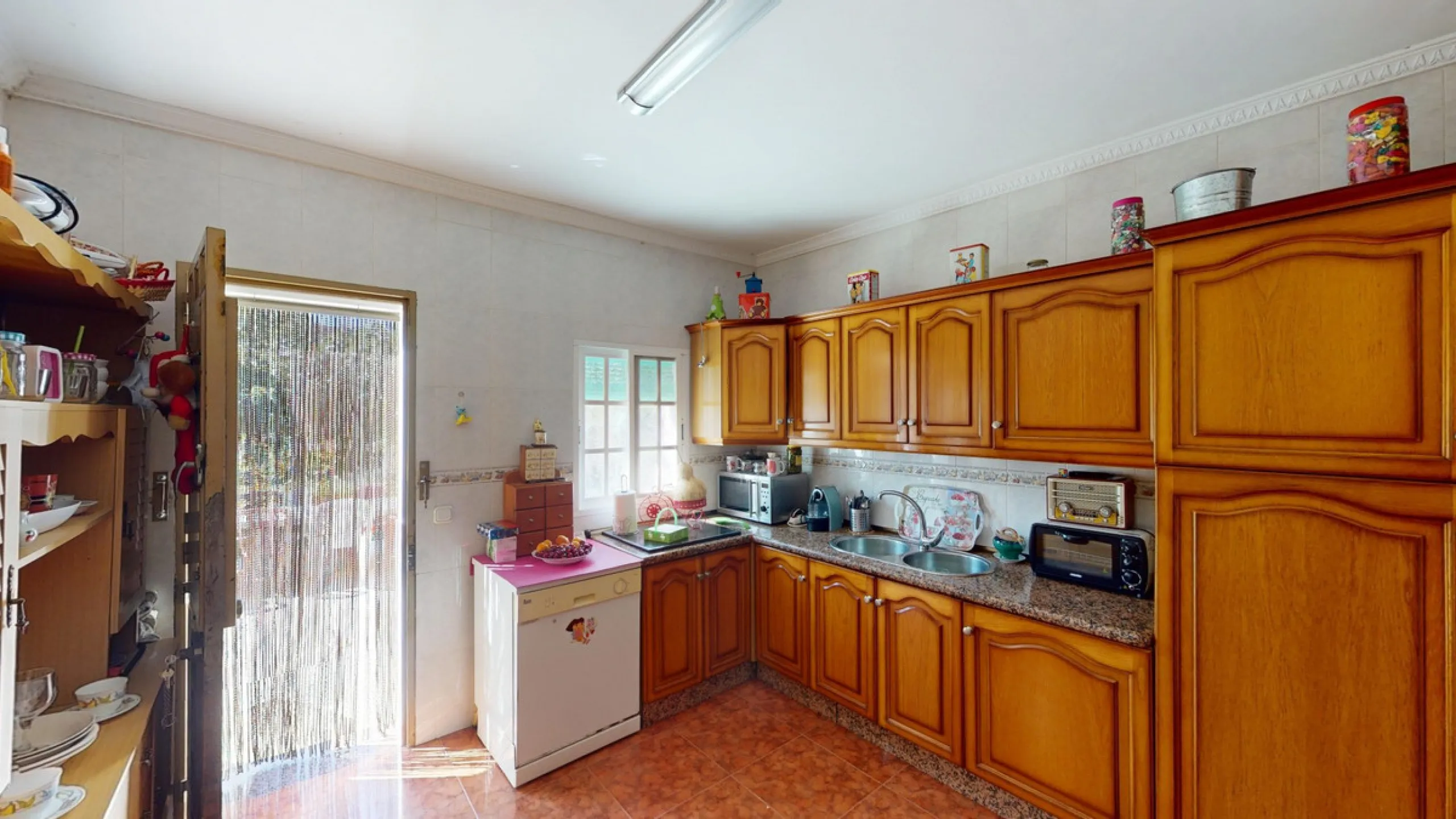 This charming finca is situated in a serene and peaceful location, offering picturesque views of the surrounding landscape. The expansive property boasts 280 magnificent mango trees, 90 stately avocado trees, and several blooming citrus trees, creating a 