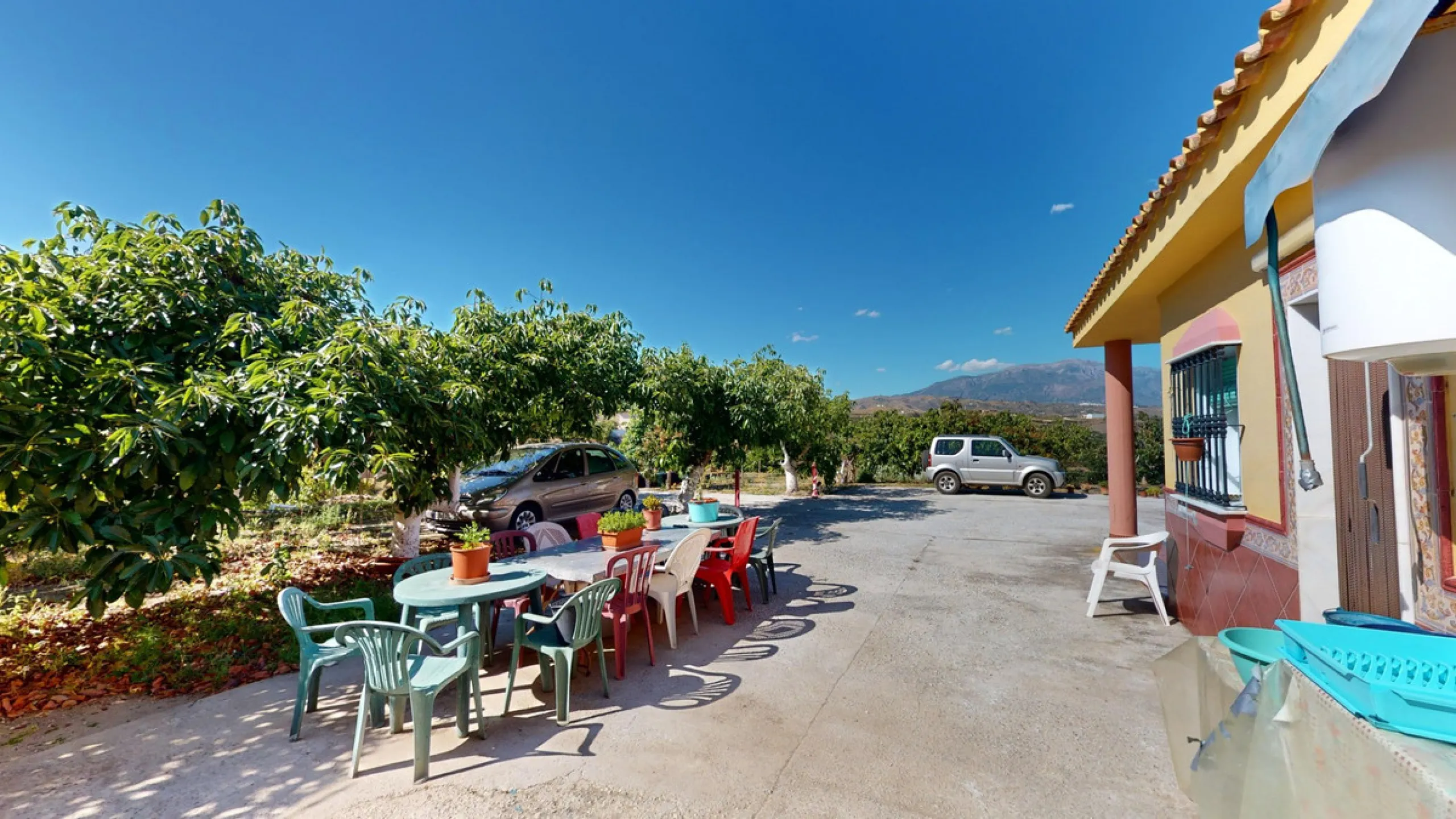 This charming finca is situated in a serene and peaceful location, offering picturesque views of the surrounding landscape. The expansive property boasts 280 magnificent mango trees, 90 stately avocado trees, and several blooming citrus trees, creating a 
