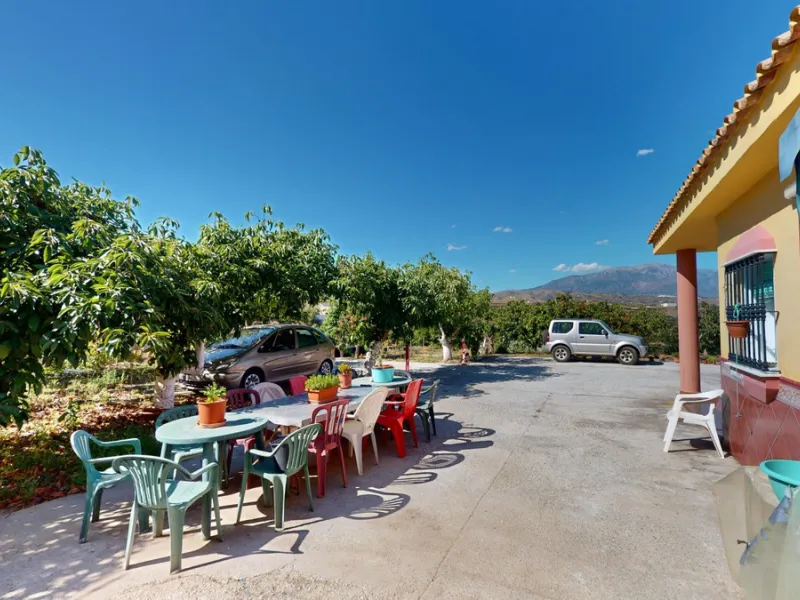 This charming finca is situated in a serene and peaceful location, offering picturesque views of the surrounding landscape. The expansive property boasts 280 magnificent mango trees, 90 stately avocado trees, and several blooming citrus trees, creating a 