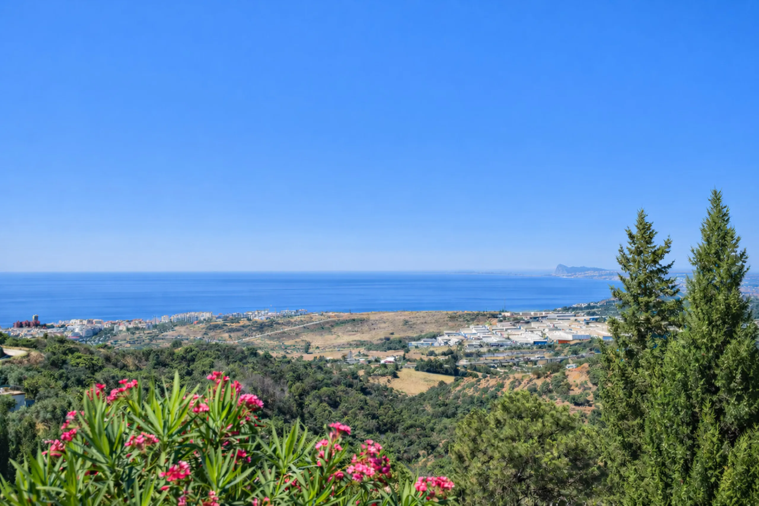 This unique property offers a rare combination of privacy, scale and income potential, set within a natural hillside environment above Estepona. Surrounded by countryside and open views, the estate enjoys far-reaching panoramas across the town, marina, Me