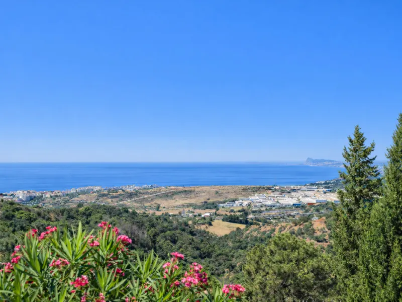 This unique property offers a rare combination of privacy, scale and income potential, set within a natural hillside environment above Estepona. Surrounded by countryside and open views, the estate enjoys far-reaching panoramas across the town, marina, Me