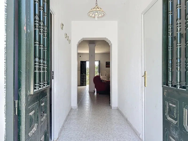 For sale: an impressive country house in Torre del Mar, perfect for those seeking a retreat in the heart of nature without sacrificing comfort. The property boasts a living area of 224 m2 and is situated on a large, fully fenced plot of 4045 m2, ensuring 