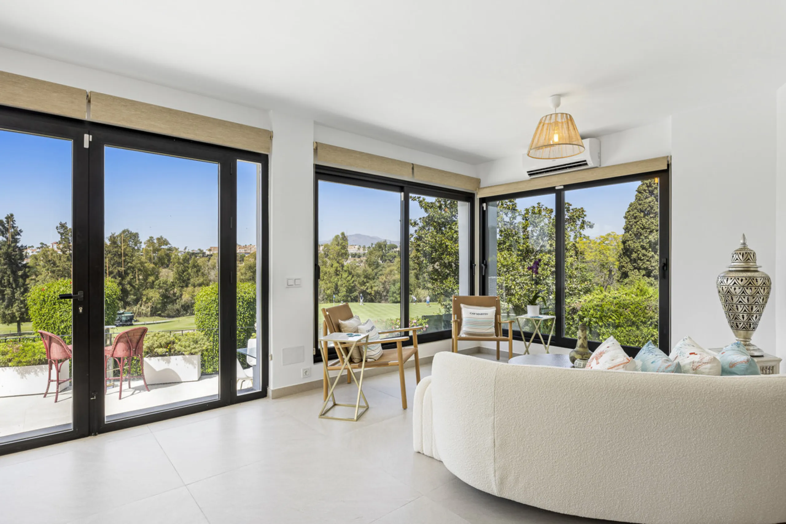 This west-facing villa boasts a modern design and is ideally situated next to the Guadalmina Golf Course. The property, spans two levels, offers privacy, convenience, and ample space for a large family.