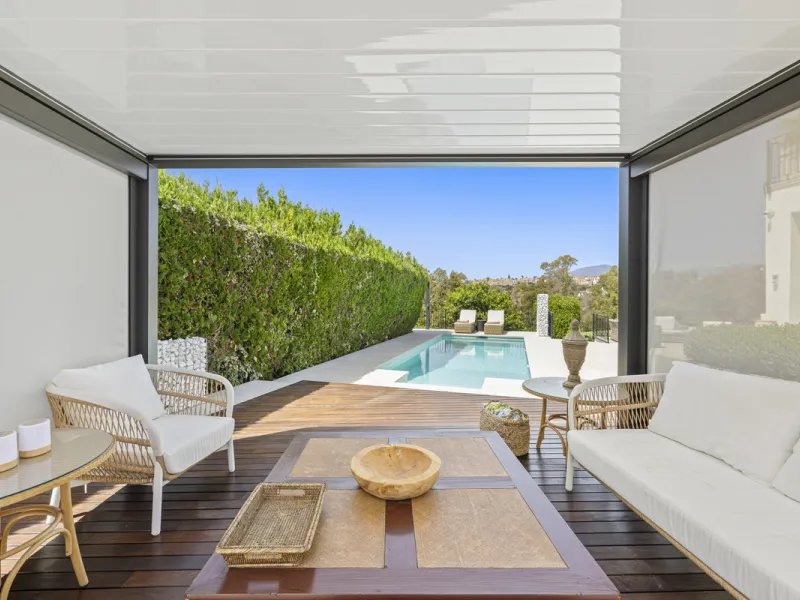 This west-facing villa boasts a modern design and is ideally situated next to the Guadalmina Golf Course. The property, spans two levels, offers privacy, convenience, and ample space for a large family.