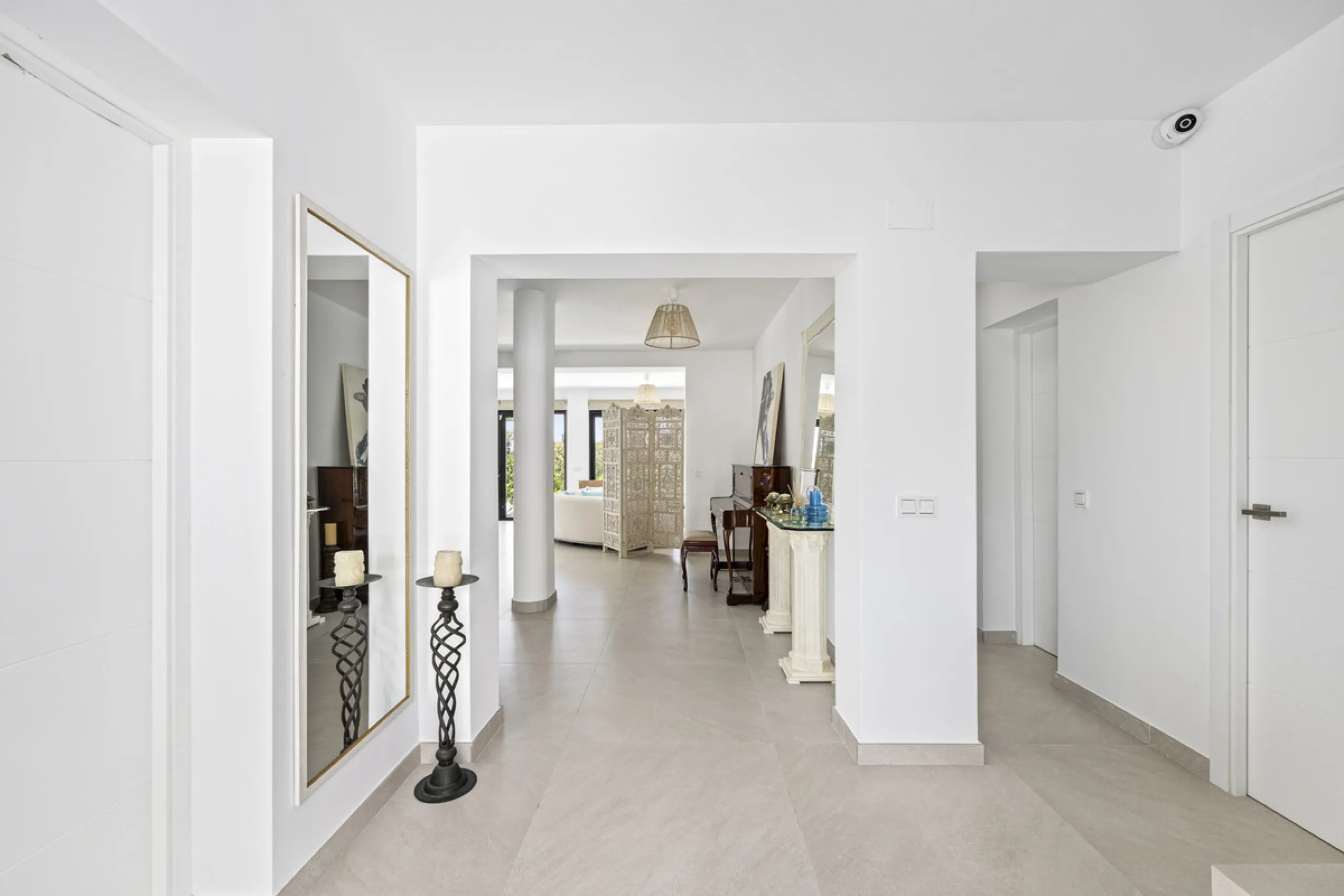 This west-facing villa boasts a modern design and is ideally situated next to the Guadalmina Golf Course. The property, spans two levels, offers privacy, convenience, and ample space for a large family.