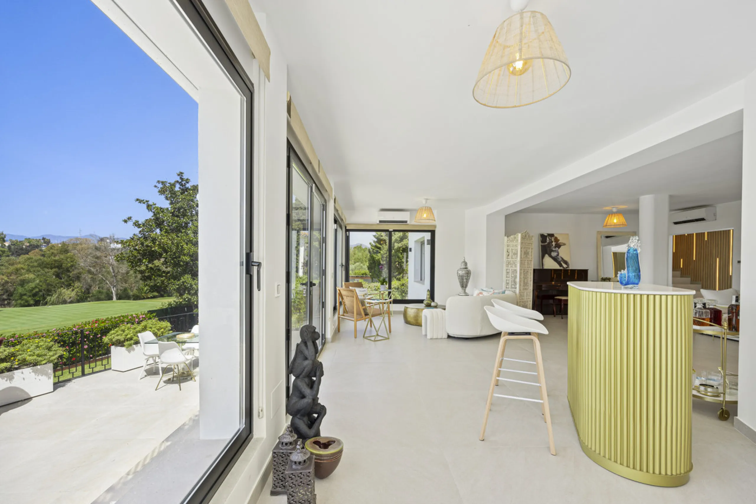 This west-facing villa boasts a modern design and is ideally situated next to the Guadalmina Golf Course. The property, spans two levels, offers privacy, convenience, and ample space for a large family.