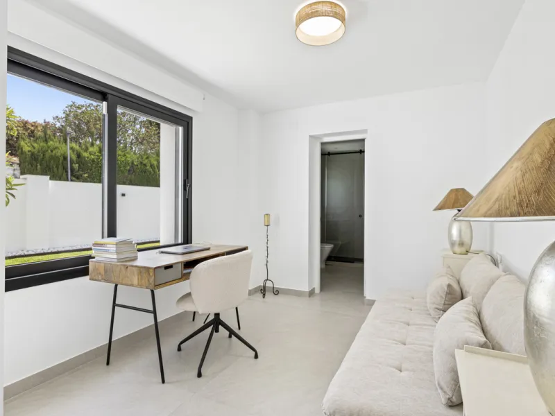 This west-facing villa boasts a modern design and is ideally situated next to the Guadalmina Golf Course. The property, spans two levels, offers privacy, convenience, and ample space for a large family.