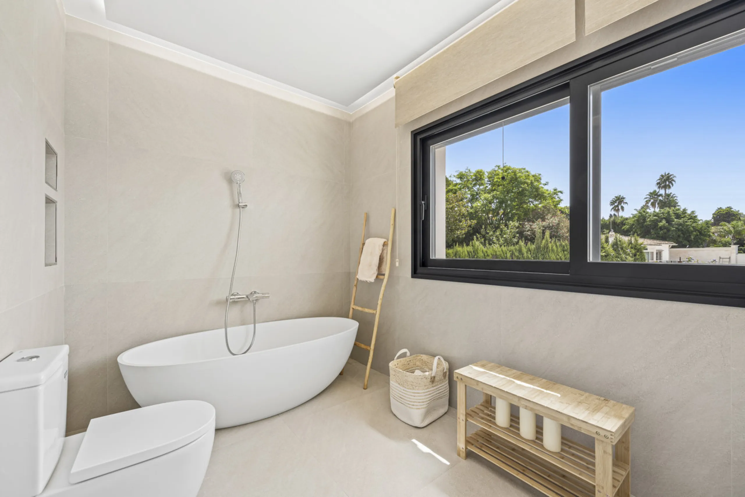 This west-facing villa boasts a modern design and is ideally situated next to the Guadalmina Golf Course. The property, spans two levels, offers privacy, convenience, and ample space for a large family.