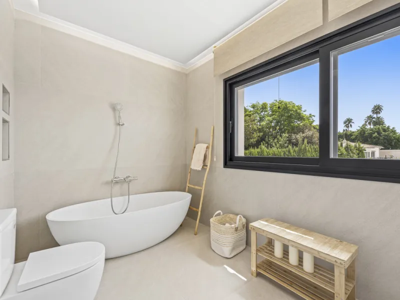 This west-facing villa boasts a modern design and is ideally situated next to the Guadalmina Golf Course. The property, spans two levels, offers privacy, convenience, and ample space for a large family.