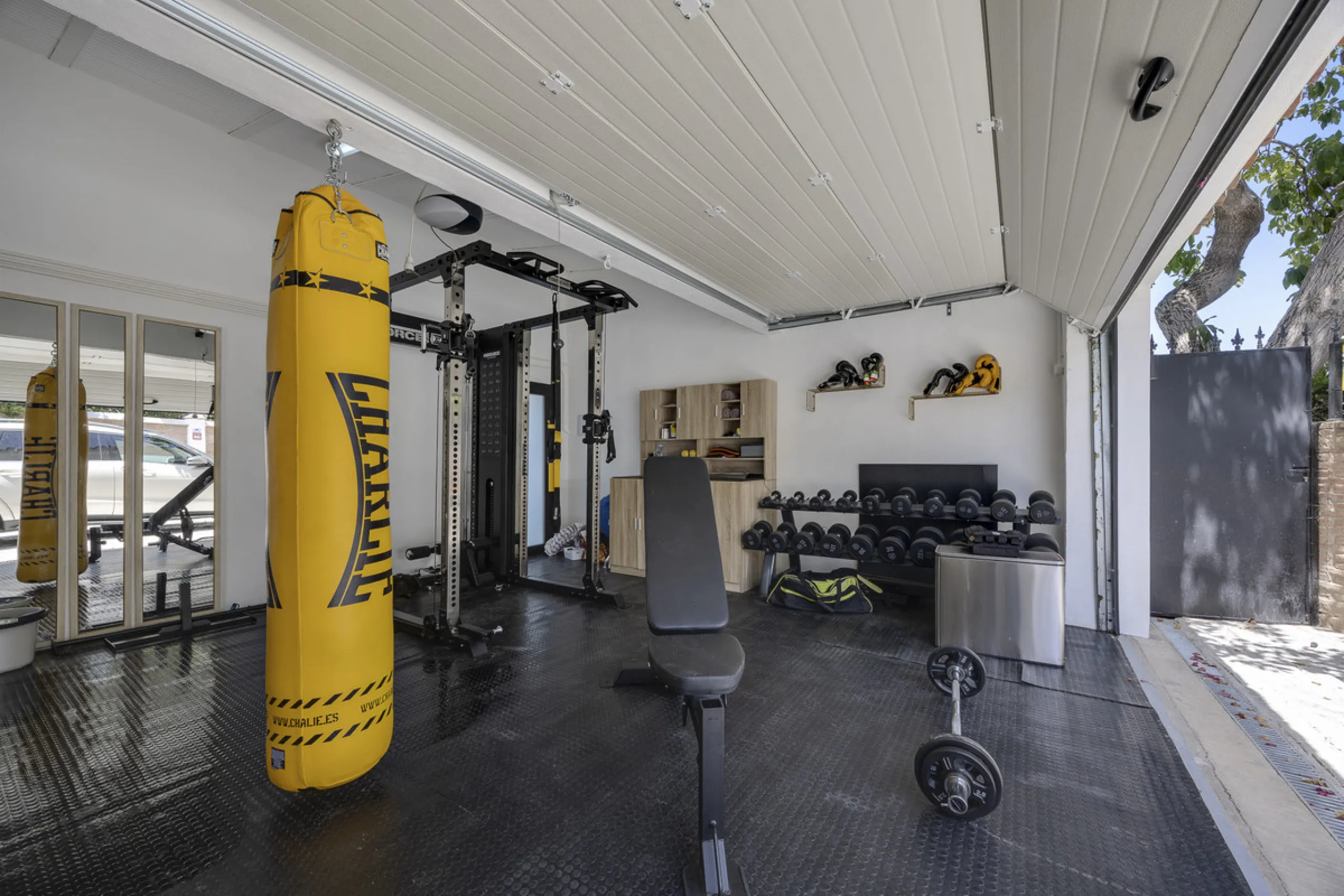 This west-facing villa boasts a modern design and is ideally situated next to the Guadalmina Golf Course. The property, spans two levels, offers privacy, convenience, and ample space for a large family.