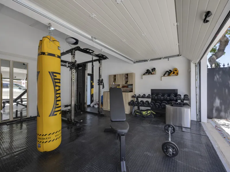 This west-facing villa boasts a modern design and is ideally situated next to the Guadalmina Golf Course. The property, spans two levels, offers privacy, convenience, and ample space for a large family.