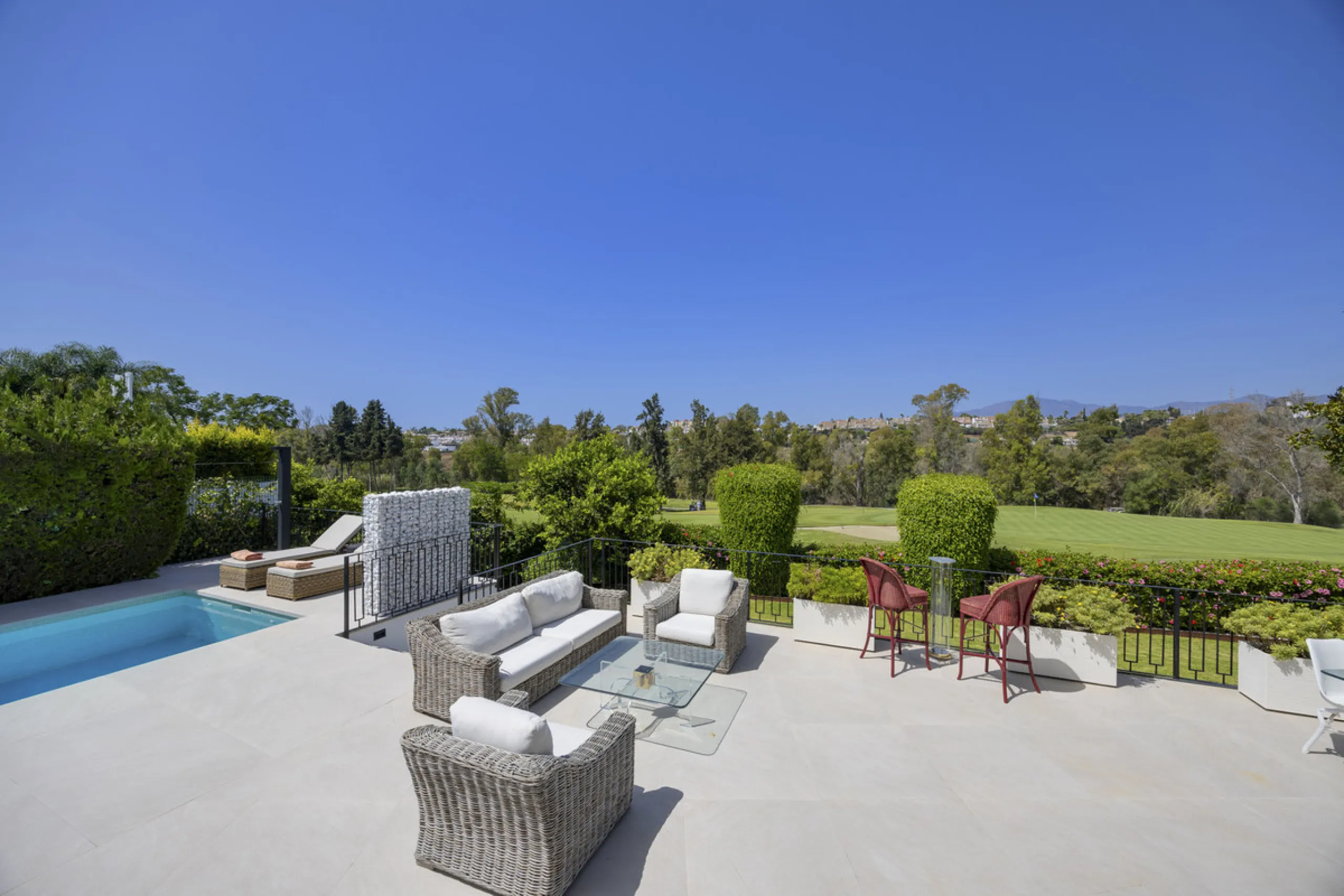 This west-facing villa boasts a modern design and is ideally situated next to the Guadalmina Golf Course. The property, spans two levels, offers privacy, convenience, and ample space for a large family.