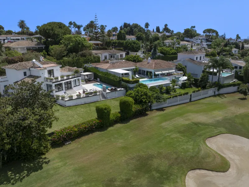 This west-facing villa boasts a modern design and is ideally situated next to the Guadalmina Golf Course. The property, spans two levels, offers privacy, convenience, and ample space for a large family.