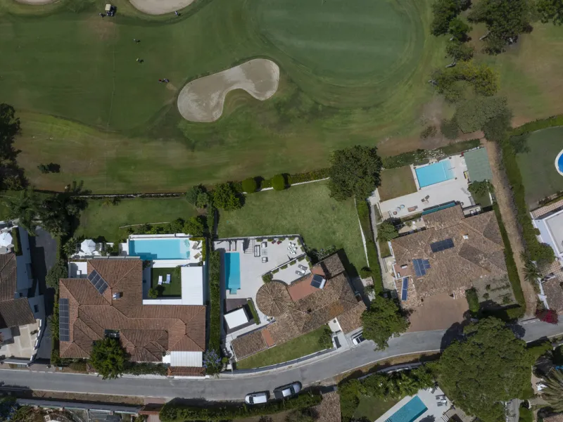 This west-facing villa boasts a modern design and is ideally situated next to the Guadalmina Golf Course. The property, spans two levels, offers privacy, convenience, and ample space for a large family.