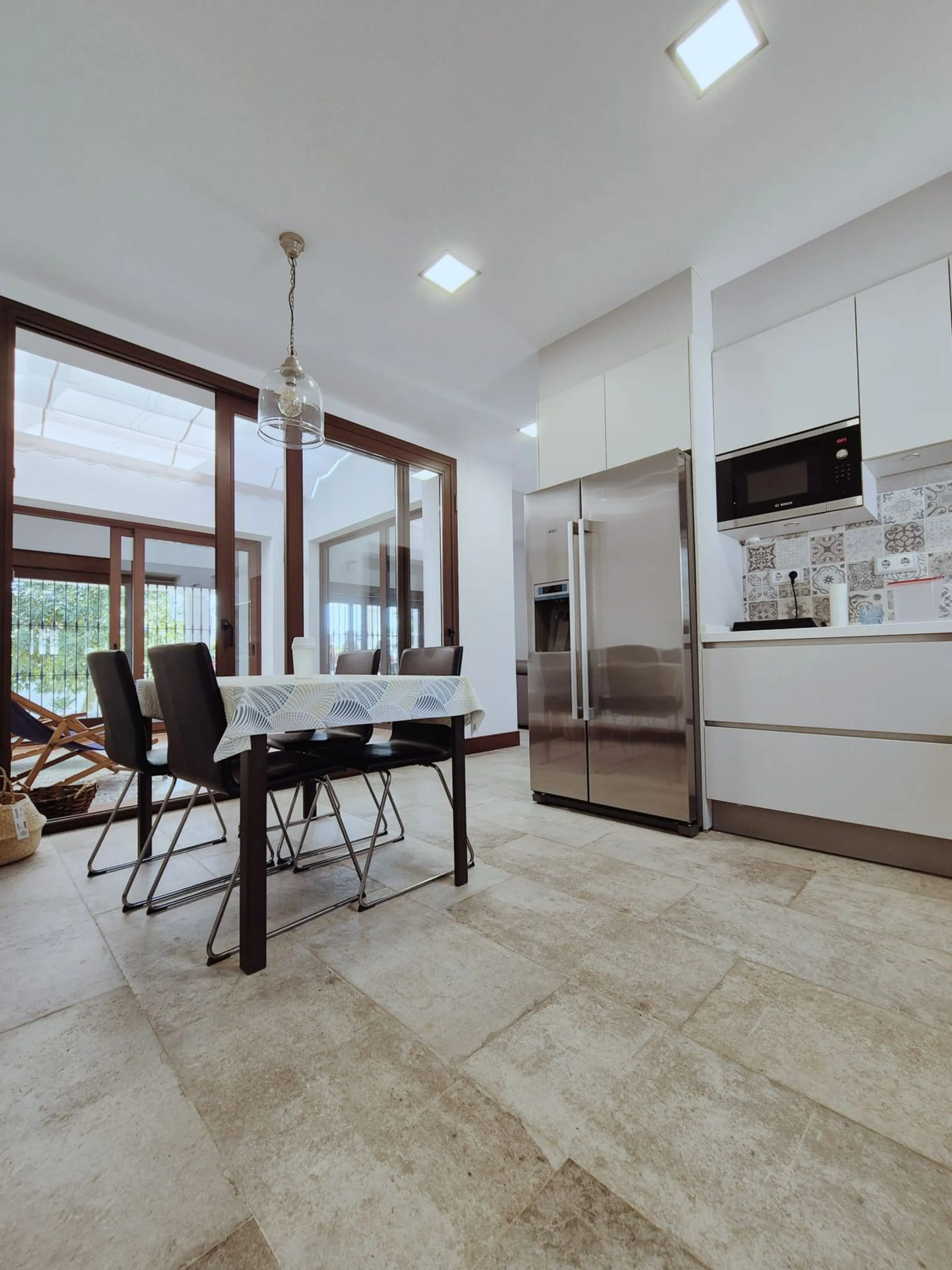 Discover this stunning Mediterranean-style home, located just a few meters from the sea. This charming residence offers an unbeatable location, with restaurants nearby and a seaside promenade within easy walking distance. The house features five spacious 
