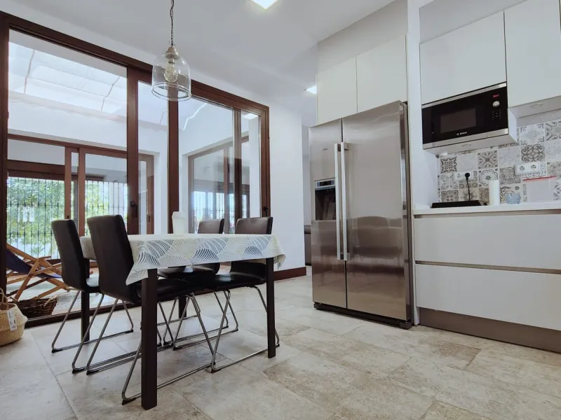 Discover this stunning Mediterranean-style home, located just a few meters from the sea. This charming residence offers an unbeatable location, with restaurants nearby and a seaside promenade within easy walking distance. The house features five spacious 