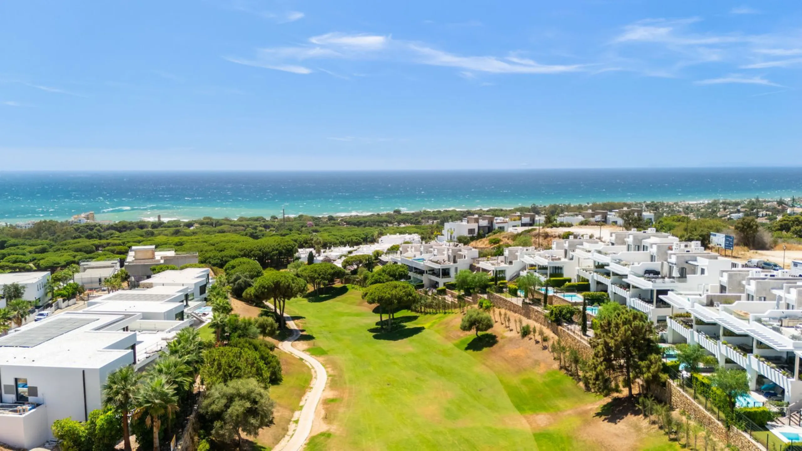 This exceptional luxury villa is situated in the prestigious area of Cabopino, Marbella East, offering a prime front line golf location with captivating views of both the sea and lush fairways. Designed to the highest standards, the property spans a gener