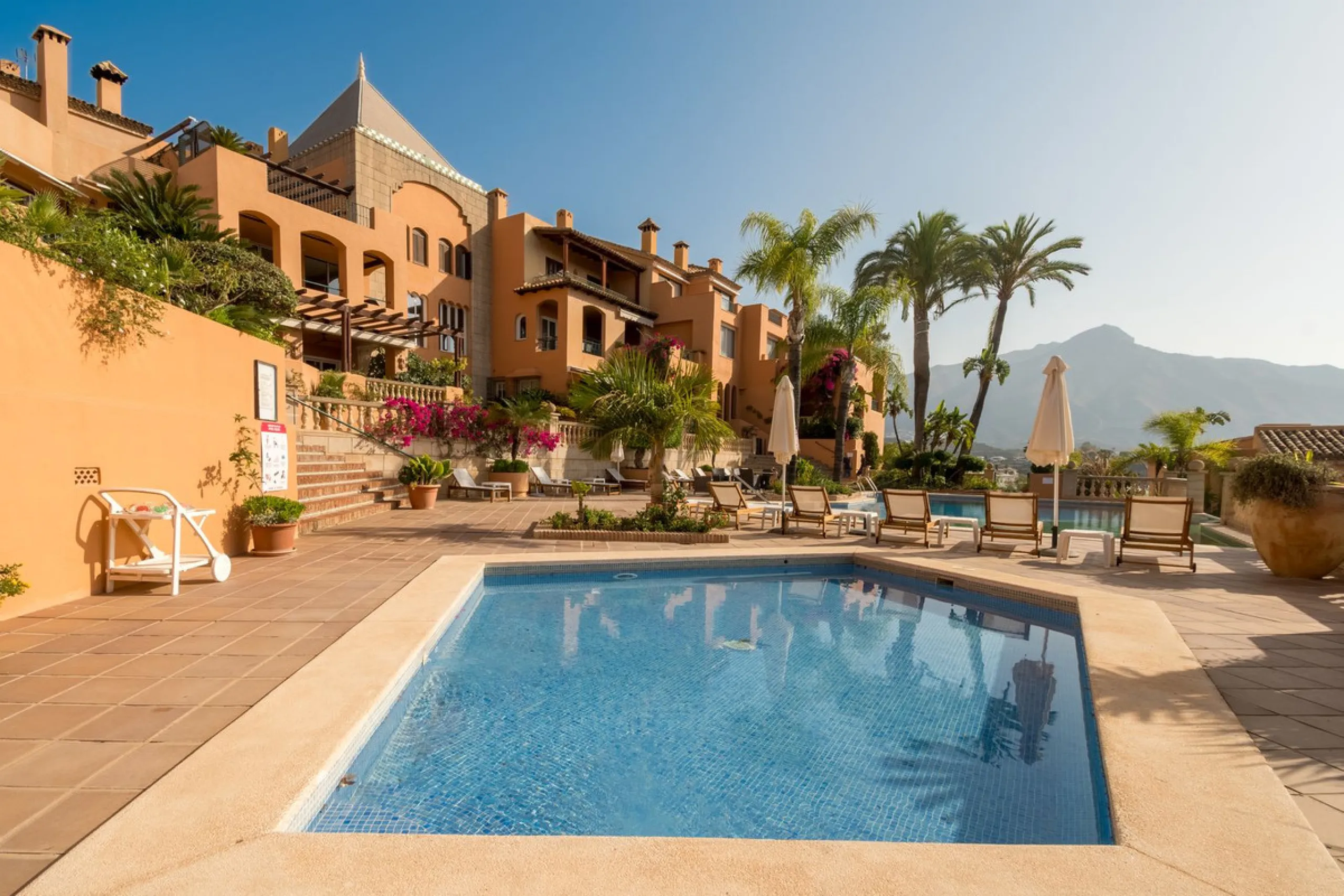 Absolutely stunning three bedroom luxury apartment located within the sought after gated and secure community of Les Belvederes in La Cerquilla, Nueva Andalucía. This stunning three-bedroom home offers uninterrupted panoramic views of the sea, mountains, 