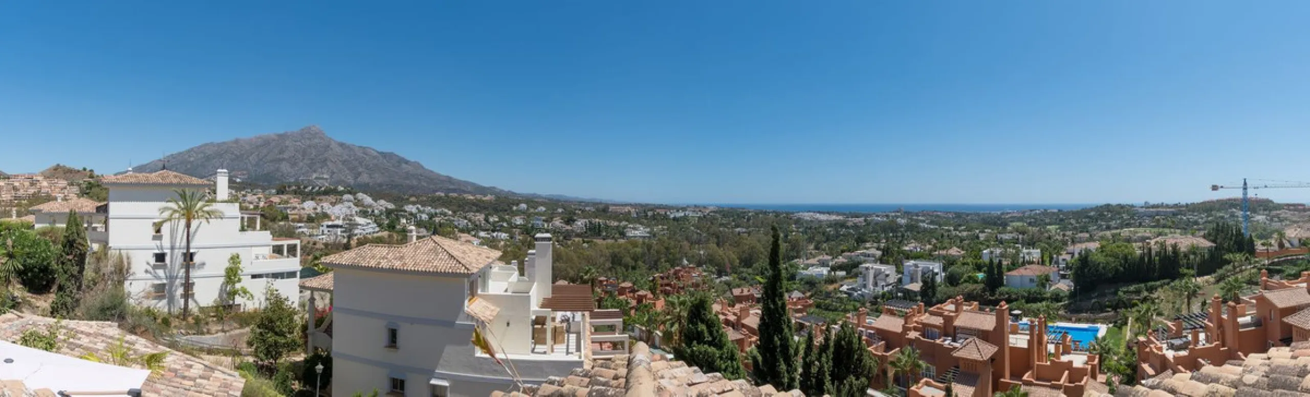 Absolutely stunning three bedroom luxury apartment located within the sought after gated and secure community of Les Belvederes in La Cerquilla, Nueva Andalucía. This stunning three-bedroom home offers uninterrupted panoramic views of the sea, mountains, 