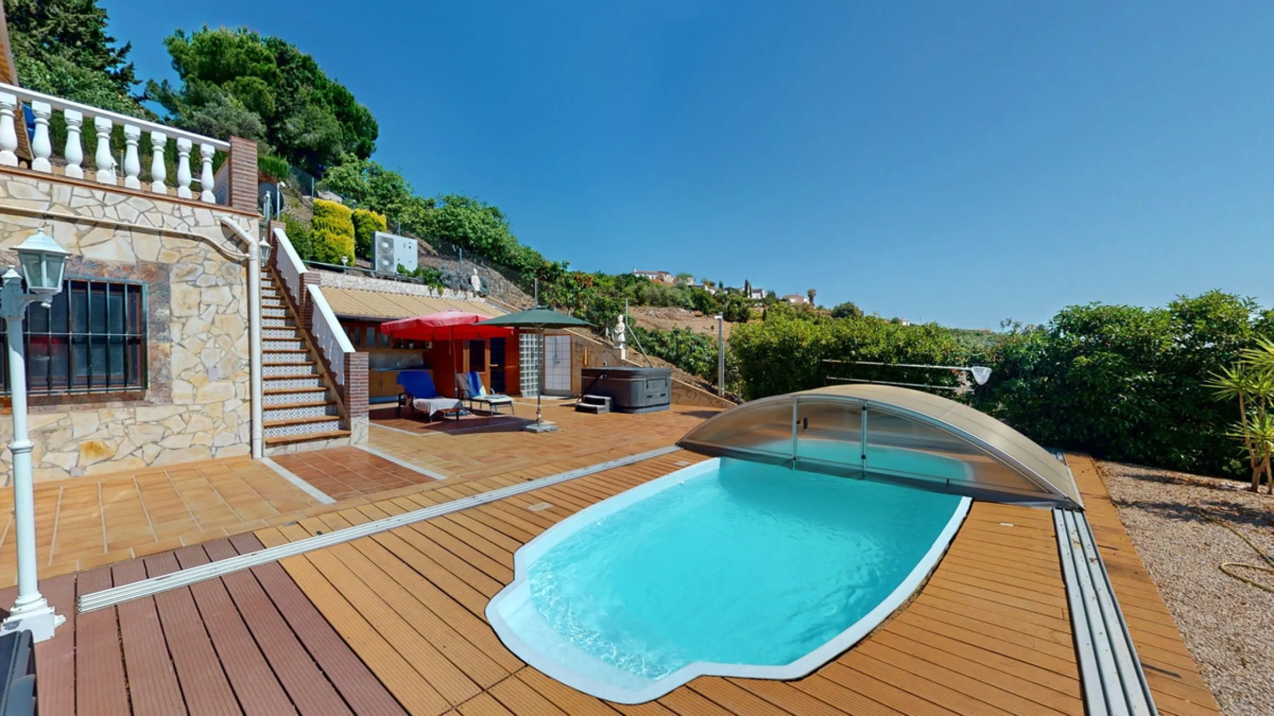 Stunning Villa Below Frigiliana for Sale. This impressive villa, nestled below Frigiliana, offers two separate living units across two floors, each with its own driveway and privacy. The upper unit spans 150 m2 and features a spacious open-plan living and