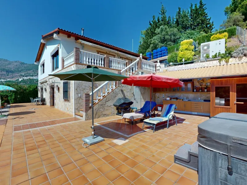 Stunning Villa Below Frigiliana for Sale. This impressive villa, nestled below Frigiliana, offers two separate living units across two floors, each with its own driveway and privacy. The upper unit spans 150 m2 and features a spacious open-plan living and