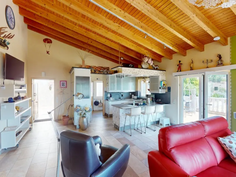 Stunning Villa Below Frigiliana for Sale. This impressive villa, nestled below Frigiliana, offers two separate living units across two floors, each with its own driveway and privacy. The upper unit spans 150 m2 and features a spacious open-plan living and