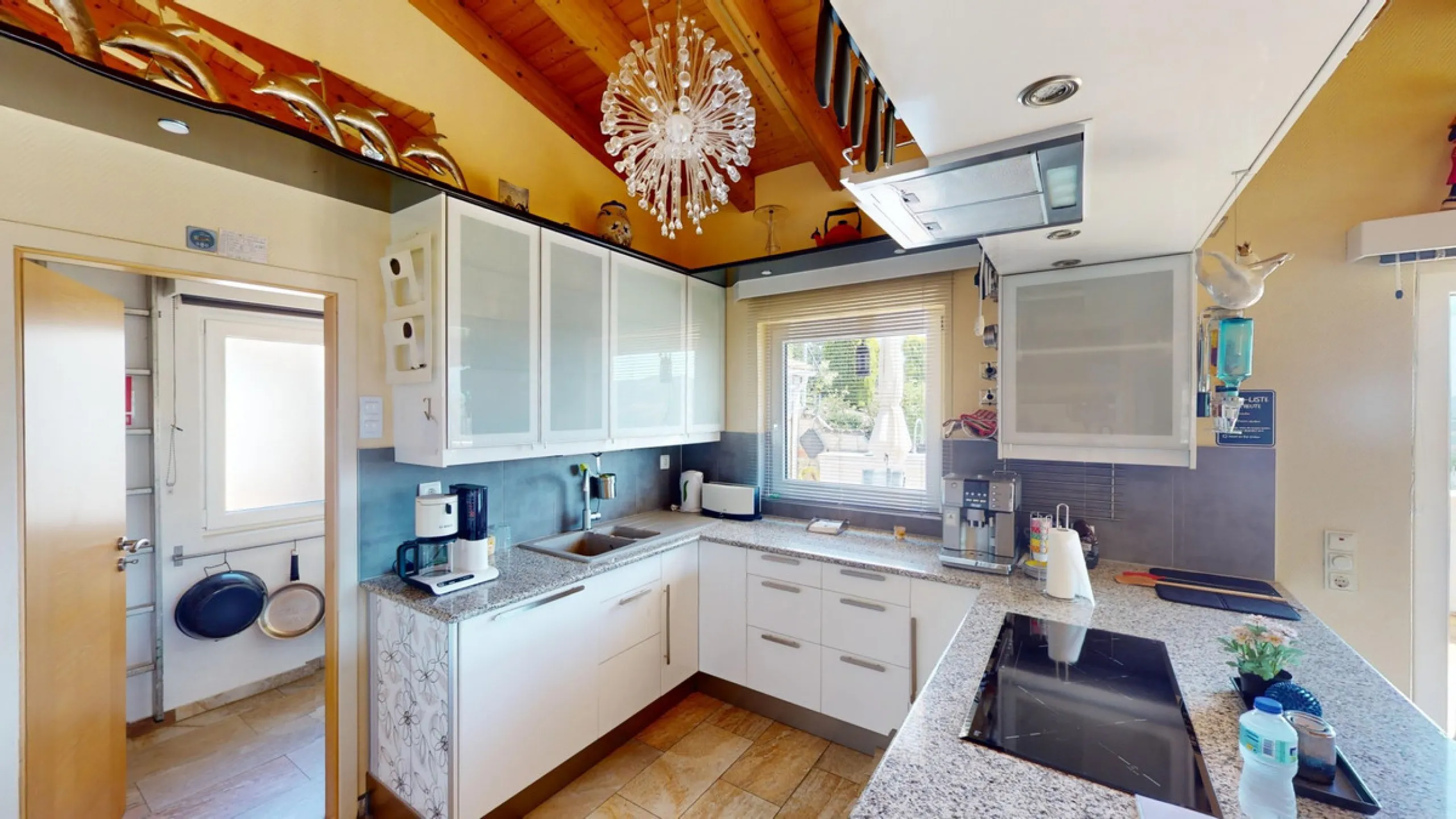 Stunning Villa Below Frigiliana for Sale. This impressive villa, nestled below Frigiliana, offers two separate living units across two floors, each with its own driveway and privacy. The upper unit spans 150 m2 and features a spacious open-plan living and