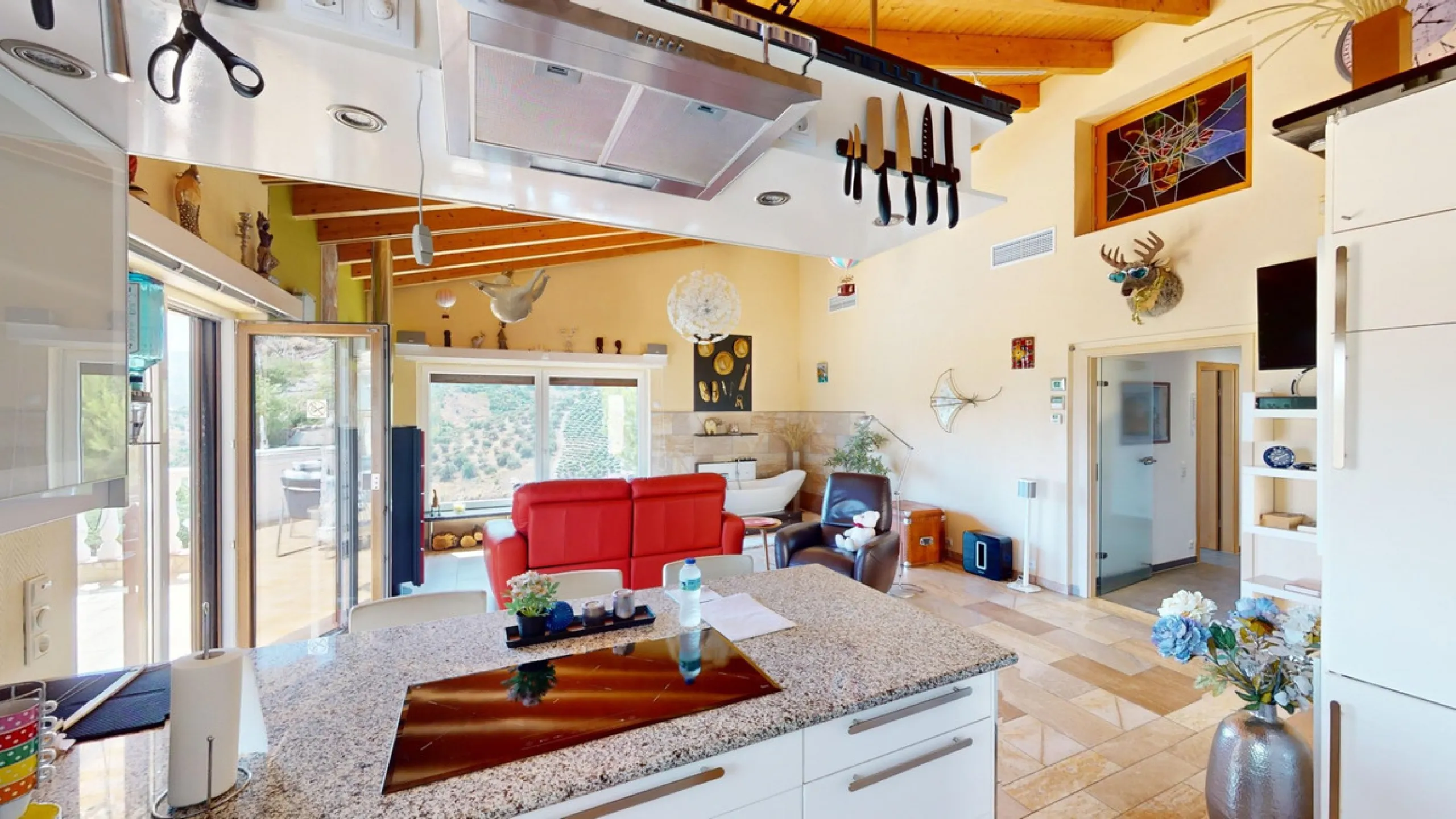 Stunning Villa Below Frigiliana for Sale. This impressive villa, nestled below Frigiliana, offers two separate living units across two floors, each with its own driveway and privacy. The upper unit spans 150 m2 and features a spacious open-plan living and