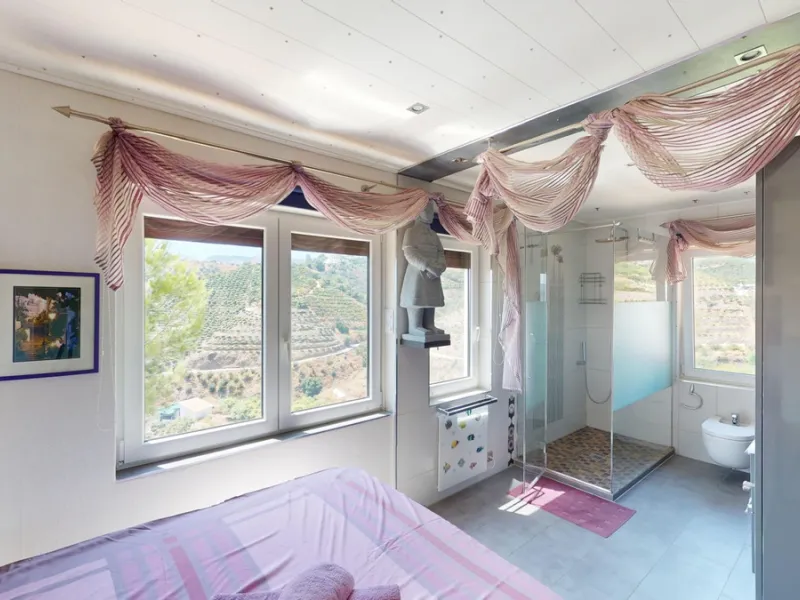 Stunning Villa Below Frigiliana for Sale. This impressive villa, nestled below Frigiliana, offers two separate living units across two floors, each with its own driveway and privacy. The upper unit spans 150 m2 and features a spacious open-plan living and